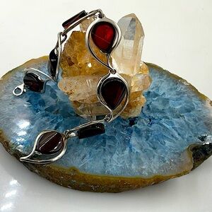 8” Silver Bracelet With Six Segments Of Cherry Amber With Inclusion.